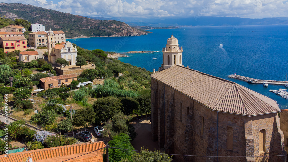 Aerial view of the two churches of Cargèse in Corsica, France - Seaside village of Greek origins with Orthodox and Catholic churches facing each other above the Mediterranean Sea