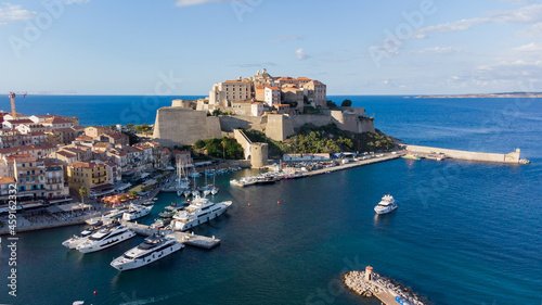 Fototapeta Naklejka Na Ścianę i Meble -  Aerial view of the Citadel of Calvi in Upper Corsica - French maritime stronghold in the Mediterranean Sea with defensive walls