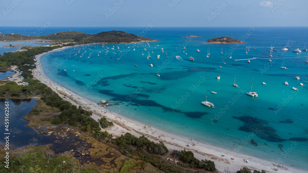 Aerial view of the beach of Saint Cyprien in the South of Corsica, France - Round bay with turquoise waters of the Mediterranean Sea