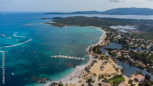 Aerial view of the beach of Saint Cyprien in the South of Corsica, France - Round bay with turquoise waters of the Mediterranean Sea