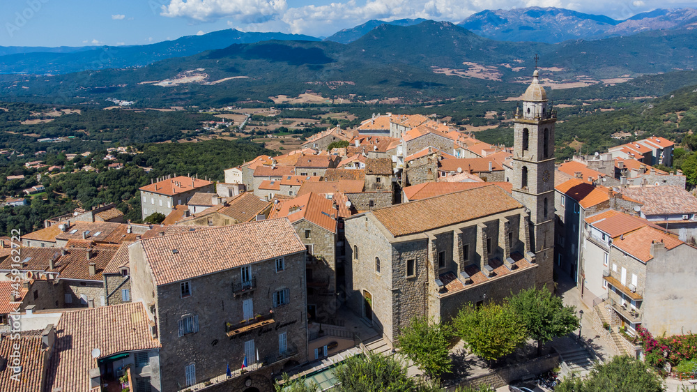 Aerial view of the Liberation Square and Church of Saint Mary of Sartène in the mountains of the South of Corsica, France - Regional capital, Sartène is mostly made of granite buildings