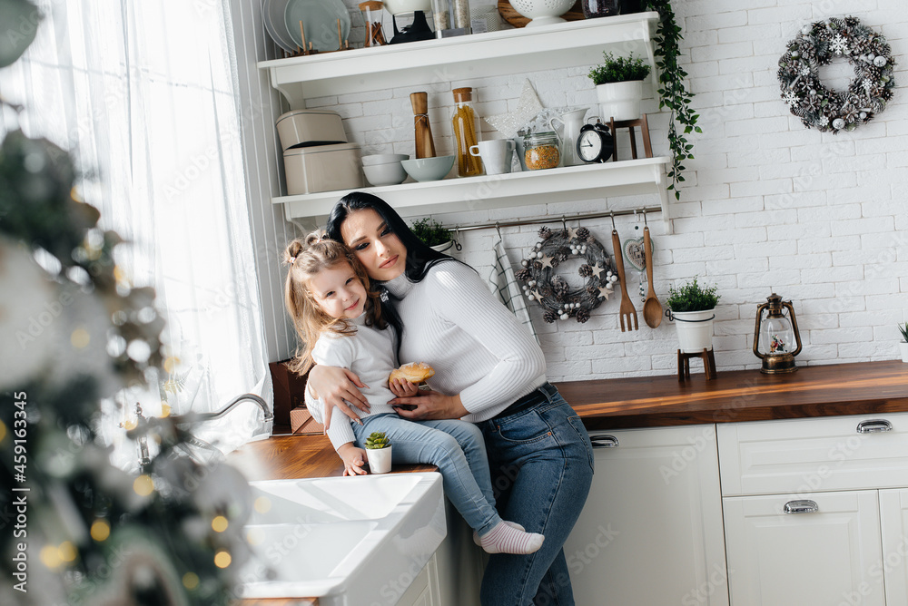 Mom and Little Daughter are preparing for the holiday and playing. Family, happiness. Mom and Little Daughter are preparing for the holiday and playing. Family, happiness.