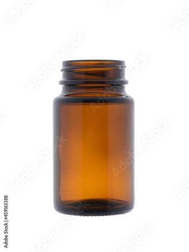Empty medical bottle made of dark brown glass. Isolated on a white background, close-up