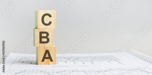 the word CBA structured query language, lined with wooden blocks