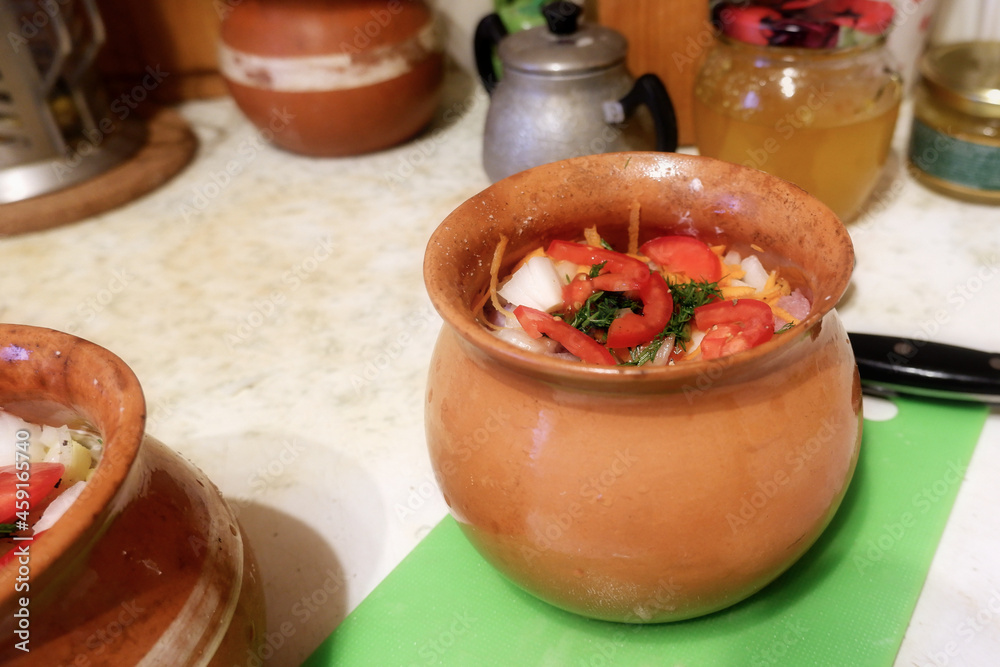 Ceramic pot of ingredients, ready to bake in the oven Ceramic pot of ingredients, ready to bake in the oven