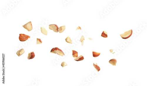 Pieces of tasty hazelnuts on white background photo