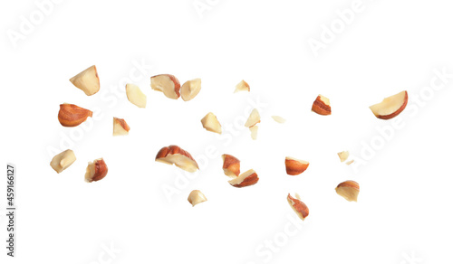 Tableau sur toile Pieces of tasty hazelnuts on white background