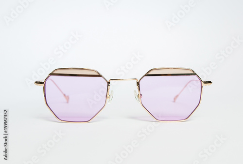 transparent pink sunglasses on white background