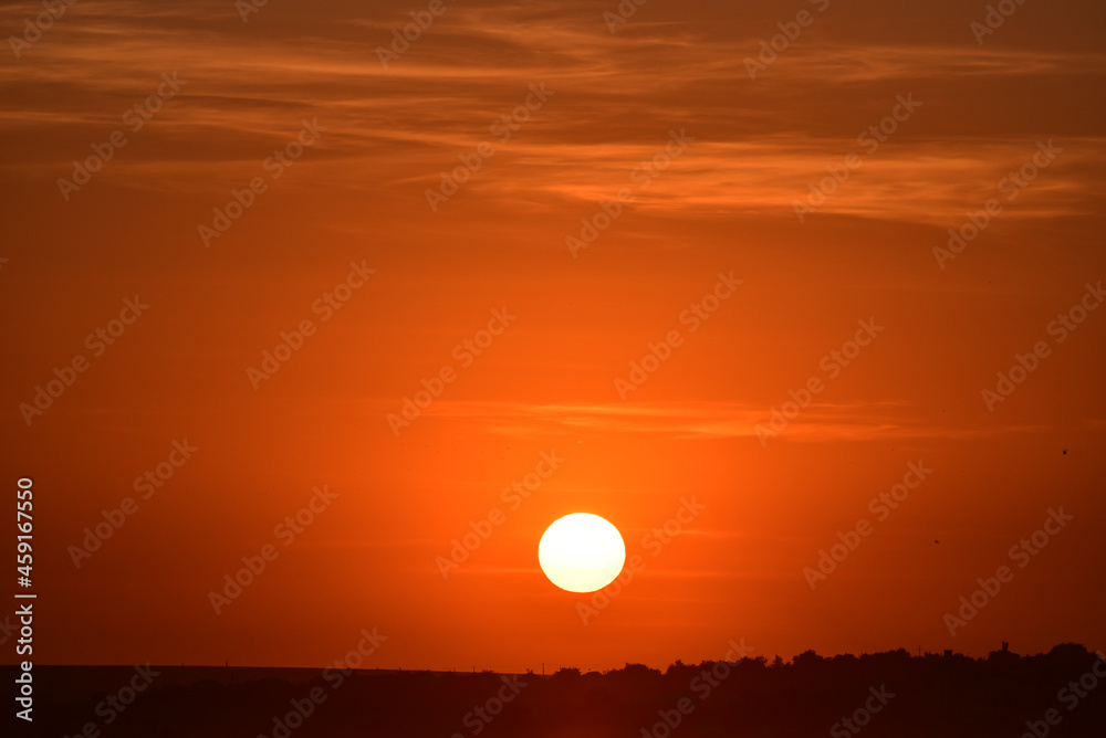 Romantic sunset  , big sun in the sky in the evening. Orange air space
