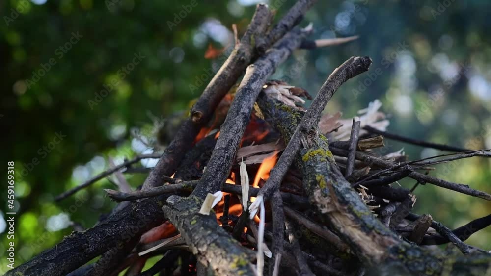 Slow-motion video of fire and flames. Kindling a fire to cook meat outside the city. Close-up. Slow-motion video of fire and flames. Kindling a fire to cook meat outside the city. Close-up.