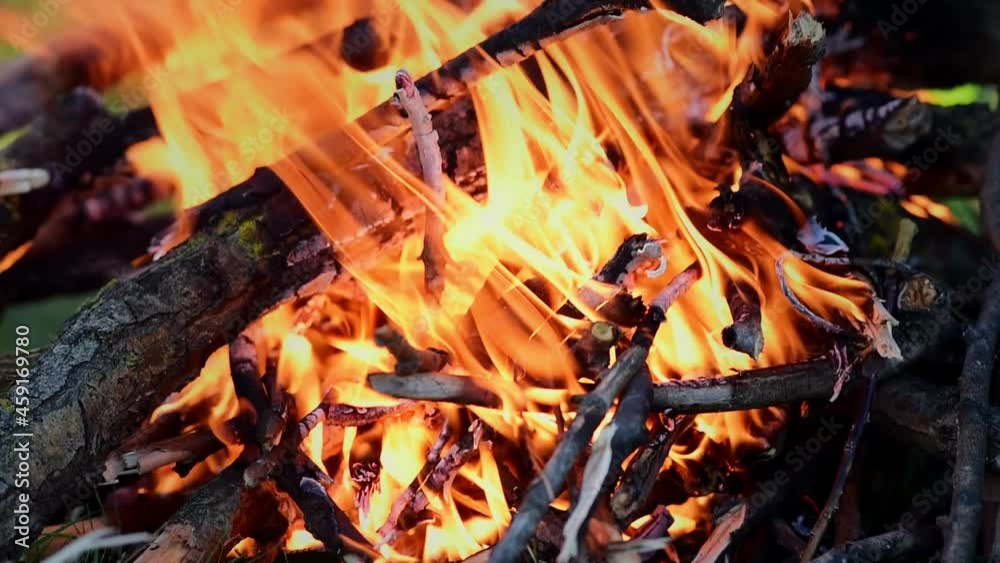 Slow-motion video of fire and flames. Kindling a fire to cook meat outside the city. Close-up. Slow-motion video of fire and flames. Kindling a fire to cook meat outside the city. Close-up.