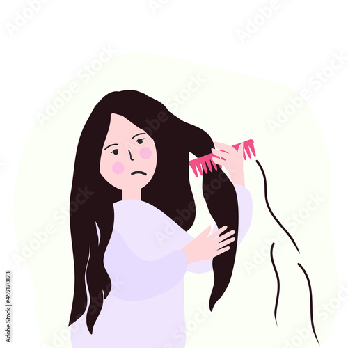 A woman, a girl combs her hair and it falls. Upset facial expression.