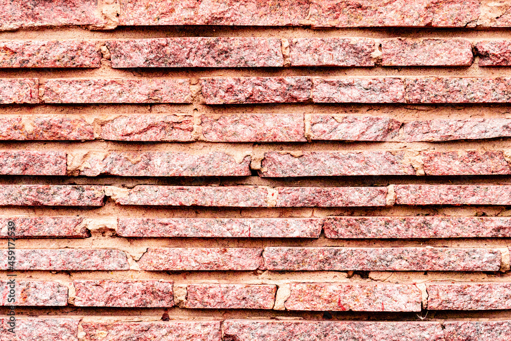 Texture of a brick wall with cracks and scratches which can be used as a background Texture of a brick wall with cracks and scratches which can be used as a background