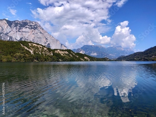 Fototapeta Naklejka Na Ścianę i Meble -  Dro, Trento: Clouds reflecting in the clear waters of Lake Cavedine, Trentino Alto Adige
