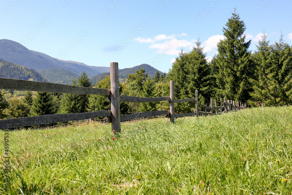 Beautiful view of mountain countryside with wooden fence