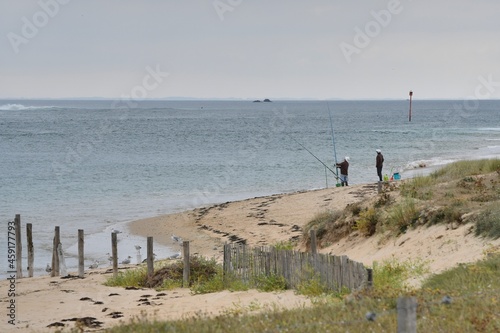 Fishermen at seaside in Brittany France photo