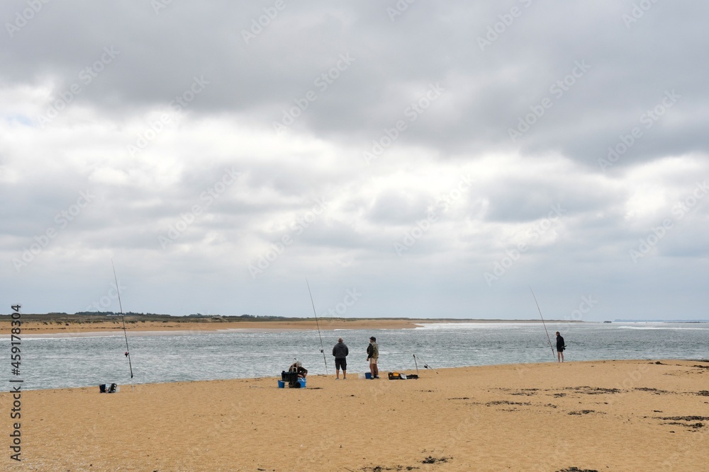 Fishermen at seaside in Brittany France