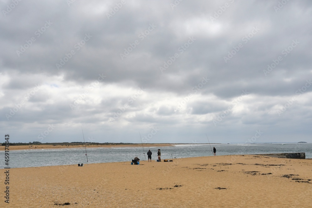 Fishermen at seaside in Brittany France