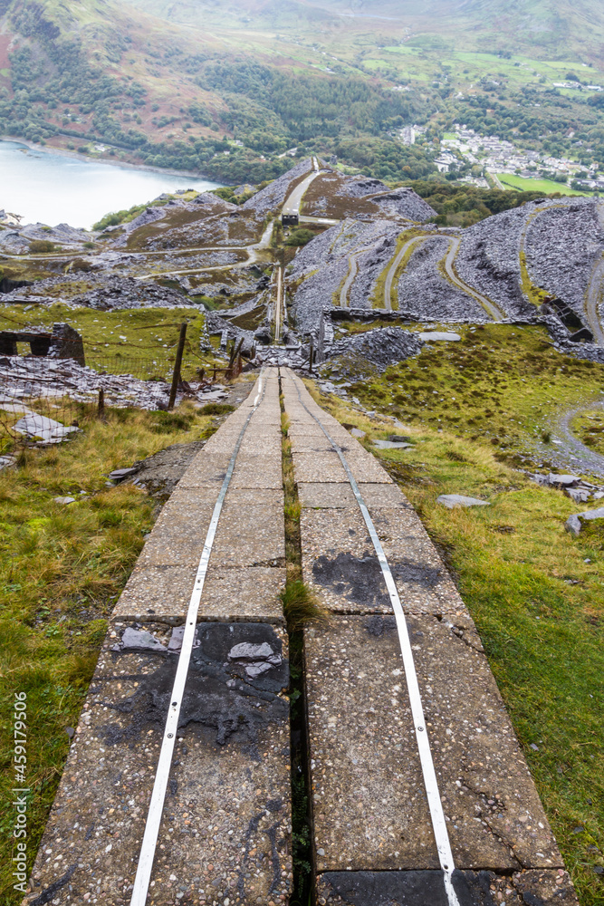 Dinorwic slate quarry with electric cable buried in concrete trough. Unesco World Heritage area, portrait.