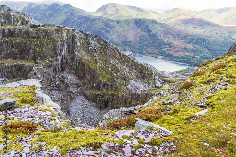 View over slate quarry to lake and mountains, landscape, Unesco Heritage Landscape.