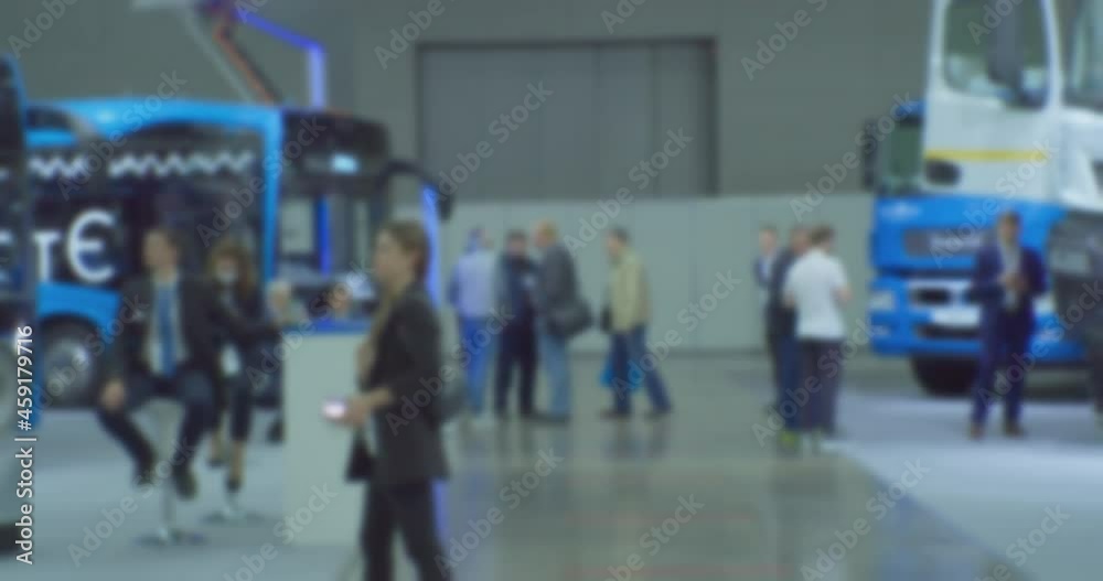 Abstract blurred background on business theme. Blurry defocused video. Unrecognizable people in a large modern building.