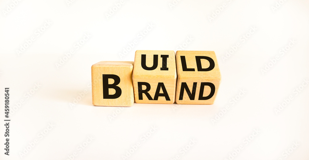 Build your brand symbol. Turned wooden cubes and changes the word 'build' to 'brand'. Beautiful white background. Build your brand and business concept. Copy space. Build your brand symbol. Turned wooden cubes and changes the word 'build' to 'brand'. Beautiful white background. Build your brand and business concept. Copy space.