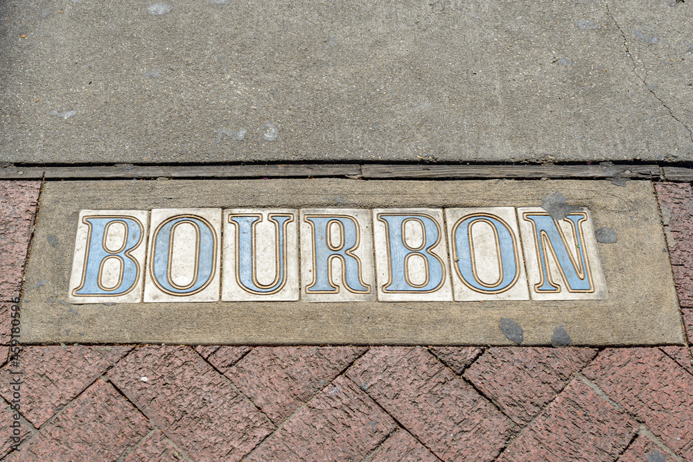 Obraz premium Traditional Bourbon Street Tile Inlay on Sidewalk in French Quarter in New Orleans, Louisiana, USA