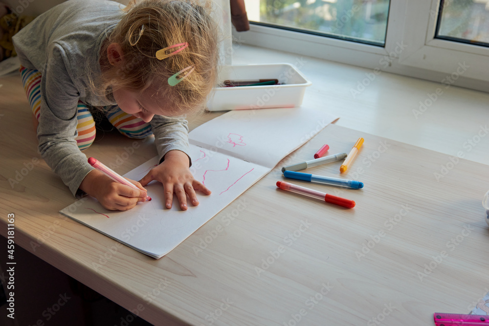 3 years girl draws a picture. Child at home, kindergarden and preschool closed during Covid-19 3 years girl draws a picture. Child at home, kindergarden and preschool closed during Covid-19