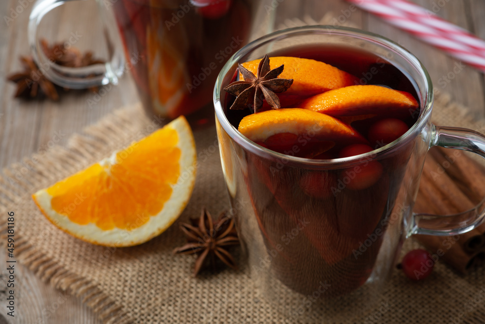 Glintwine with citrus and anise. Christmas and winter warming beverage on wooden background Glintwine with citrus and anise. Christmas and winter warming beverage on wooden background