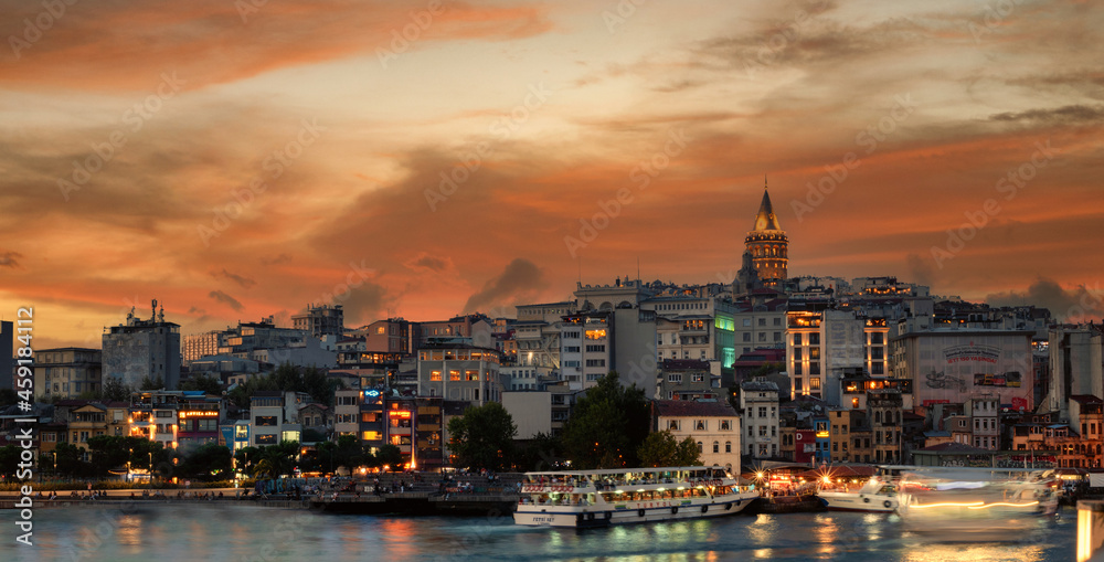 Slow exposure sunset panorama scene from Galata Bridge looking towards the Galata Tower in Beyoglu