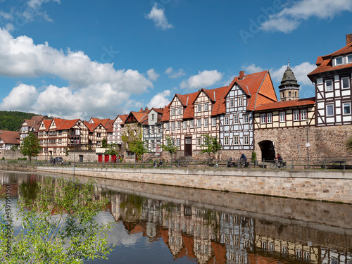 Panorama of colorful houses at the Fulda riverside in historic town Hannoversch Munden, Germany photo