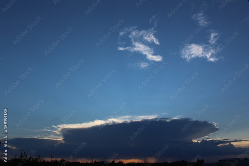 Thunderstorm forming in the distance with the sunset going behind it, classic West Texas Desert landscapes and scenery