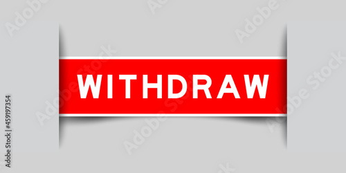 Inserted red color label sticker with word withdraw  on gray background