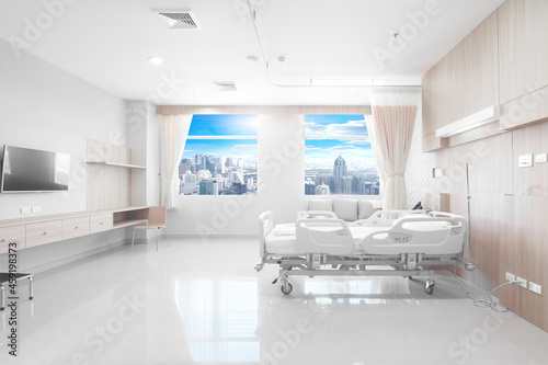 Modern Recovery Room with beds and comfortable medical equipped in a hospital with urban scene as background