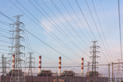 Gas turbine electrical power plant and high voltage electric pole with sunrise