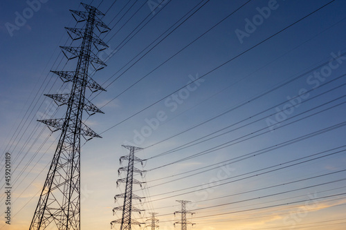 high voltage electric pole with sunrise