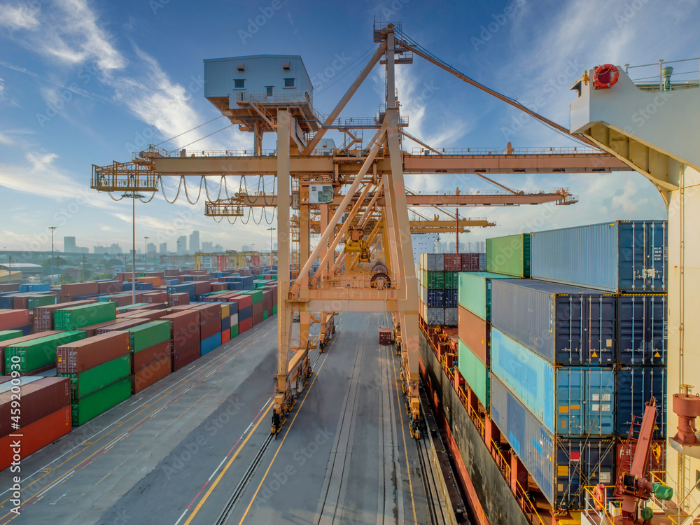 Poster Container loading in a cargo freight ship with crane to shore ...