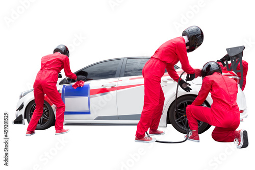 Pit stop with team maintaining technical service for a racing car during competition event isolated on white background with clipping path
