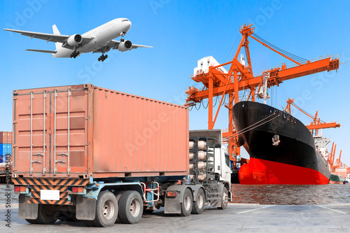 Container truck commercial delivery cargo and container ship being loaded and air plane on the sky at the harbor