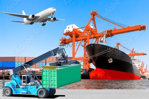 Crane lifts a container to commercial delivery cargo container truck and container ship being unloaded and air plane on the sky at the harbor