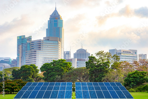 Solar energy for modern and clean renewable energy from the sun with urban landscape landmarks