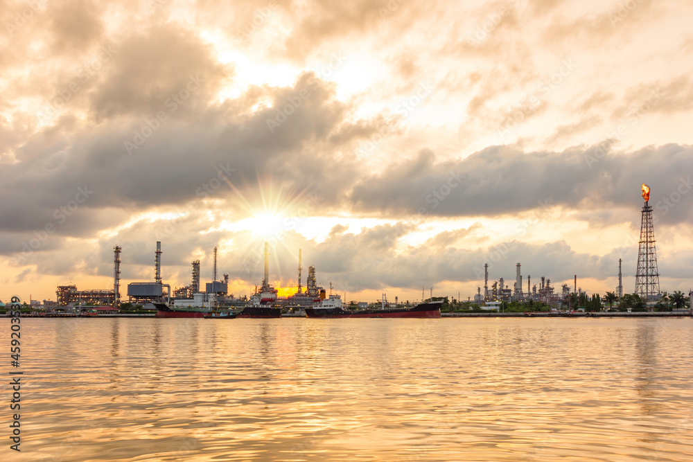Oil refinery petrochemical industrial plant in sunrise