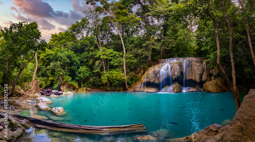 Fototapeta Naklejka Na Ścianę i Meble -  Panorama photo of erawan waterfall in the tropical jungle surrounded by a natural with turquoise clear fresh water and green forest on mountain in kanchanaburi, thailand.
