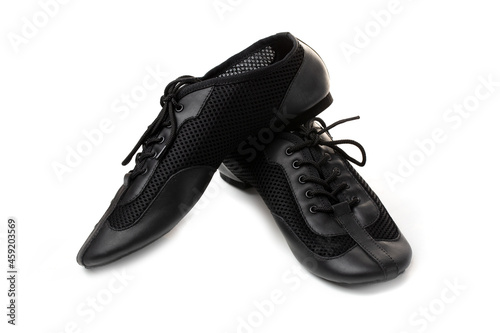 Professional black ballet shoes for jazz dance on a white background.