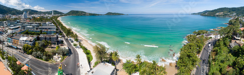 Aerial view of panorama Patong bay at phuket island on September 17-2021 Beautiful island in thailand Amazing High angle view Island seashore with blue sky cloudy sky background Travel holiday Concept