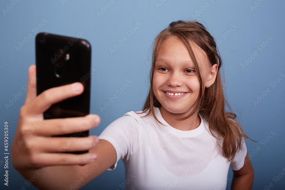 a beautiful girl of 11 years old takes a selfie a beautiful girl of 11 years old takes a selfie