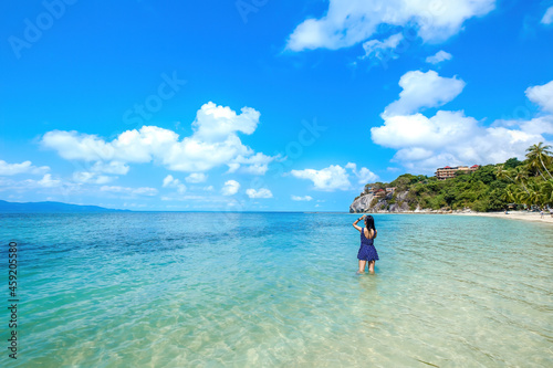 Photography woman in blue dress on the beach, at leela beach koh phangan ,suratthani,thailan