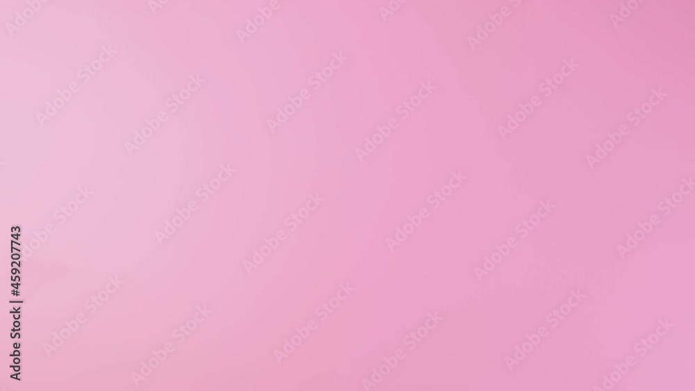 Close-up of a man's hand pointing to the left side, showing a thumb sign isolated on a pink studio background. High quality 4k footage Close-up of a man's hand pointing to the left side, showing a thumb sign isolated on a pink studio background. High quality 4k footage