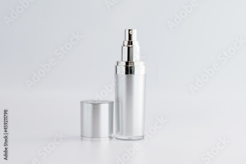 blank cosmetic pump top silver bottle mock up on background with copy space