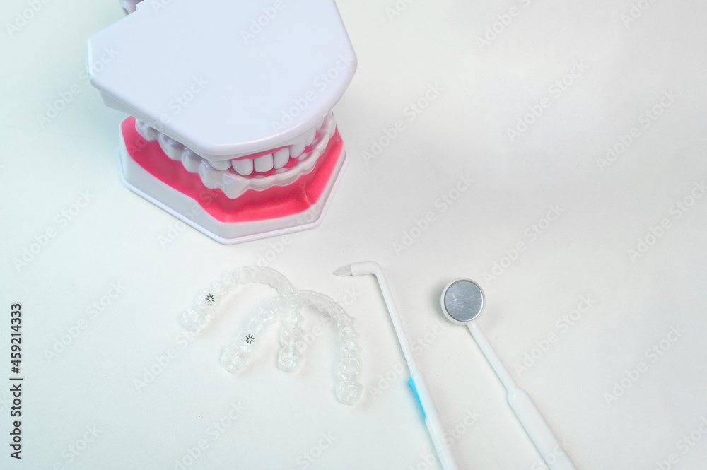 Invisalign braces and tools for dental care, dental healthcare and Orthodontic concept. Invisalign braces and tools for dental care, dental healthcare and Orthodontic concept.